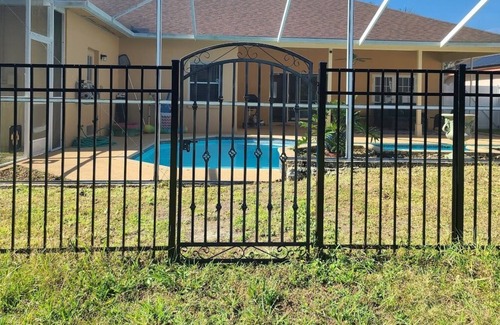 Grand Oaks House | Cheerful 4 Bd 3 Ba Home with Screened Patio & Pool