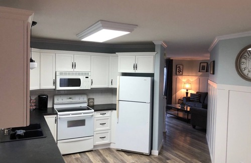Red Deer House | Cheerful, cozy 4 bedroom house w/hot tub and firepit area