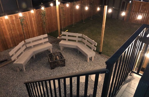 Red Deer House | Cheerful, cozy 4 bedroom house w/hot tub and firepit area