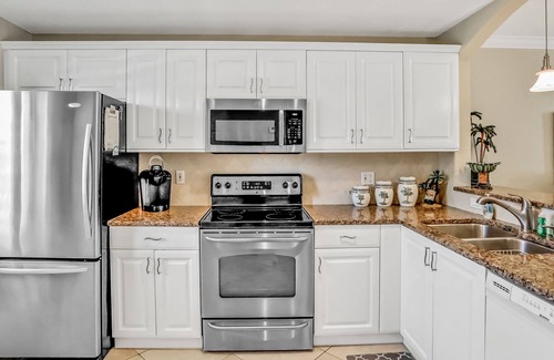 Capri Isle Condo | Chic condo near St. Petersburg w/pool & waterway views - walk to beach
