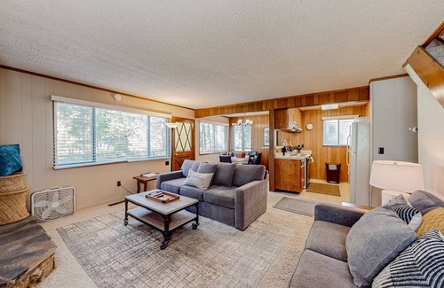 Tahoe Island Cabin | Classic central cabin near river with large tree-lined deck, grassy yard & gym