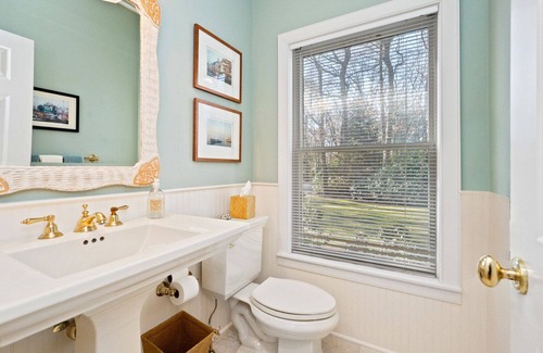 Wainscott Woods House | Classic Summer home with heated pool, hot tub, deck, outdoor seating,...