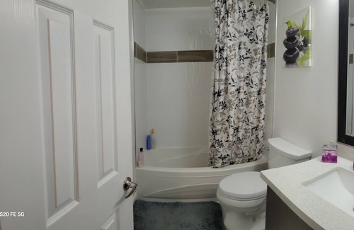 Durham Region House | Clean apartment with 4 free parking spaces.