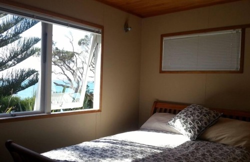 Matapouri House | Cliff top stunningly located original bach