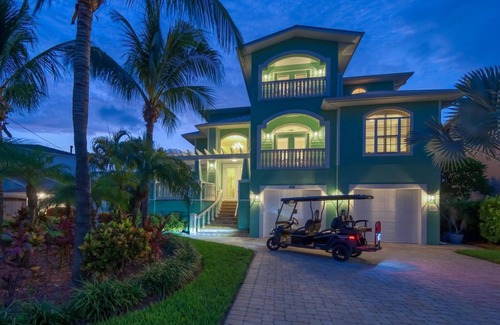 Indian Rocks Beach House | Coastal Elegance: Retreat with Heated Pool, Golf Cart, and Entertainment Haven