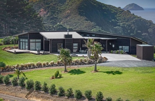 Kaeo House | Coastal Gem. Great sea views, decks for outdoor living and safe swimming beach.