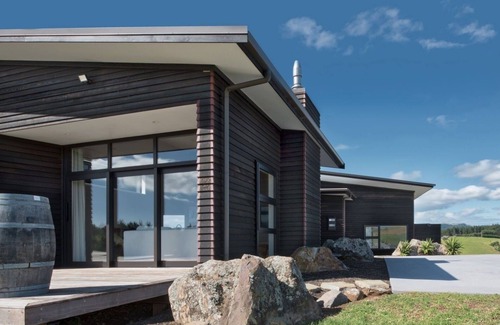 Kaeo House | Coastal Gem. Great sea views, decks for outdoor living and safe swimming beach.