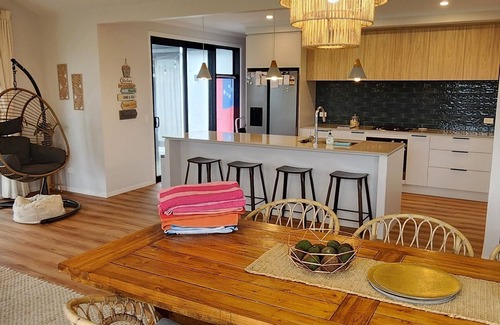 Papamoa Beach House | Coastal spacious 4-bedroom house close to beach with spa.
