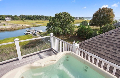 Westhampton House | Coastal traditional canal-front home with water views from most rooms....