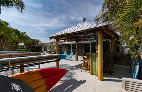 Cocoa Isles House | Cocoa Beach Waterfront Home with Tiki Bar and Pool