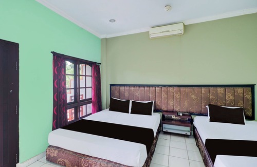 Cokroaminto Hotel | Collection O Bali near Terminal Ubung formerly Batukaru Garden Hotel