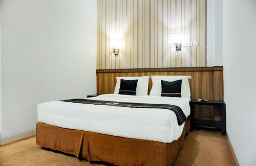 Palembang Hotel | Collection O R.Sukamto Near Palembang Trade Center Mall