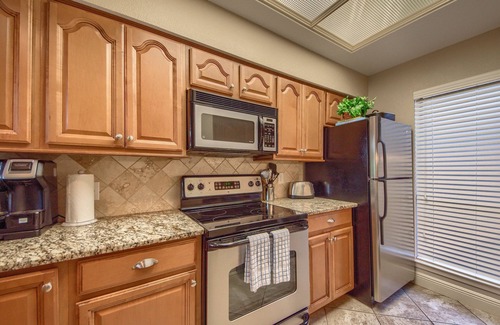 New Braunfels Condo | Comal Riverfront with 2 decks! Schlitterbahn! Pool, hot tub & river access!