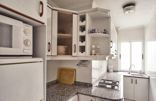 Alicante Apartment | Comfortable conditioned apartment with three dormitories sorrounded by gardens.