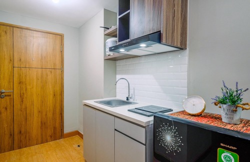 Duren Sawit Apartment | Comfortable Pool View Studio Room at LRT City Jatibening Apartment