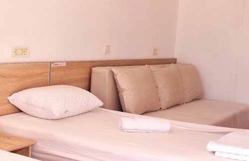 Gjerana Hotel | Comfy twin room with separated beds, double sofa bed - sea view balcony