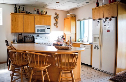 Olympia Apartment | Complete apartment with separate entrance, sunroom, paddle boards, kayaks, etc.