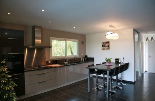 Luzech House | Contemporary home with heated pool
