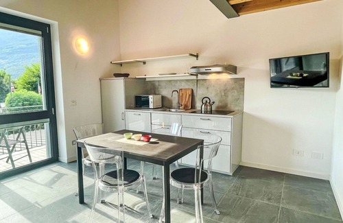 Dervio Apartment | Cosy apartment for 4 guests with A/C, WIFI, pool, TV, patio, panoramic view and parking