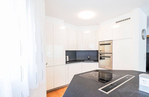 Leukerbad Apartment | Cosy apartment for 8 guests with hot tub, WIFI, TV, balcony and panoramic view