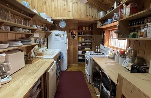 Standish Cottage | Cottage nestled in the woods overlooking Sebago Lake.