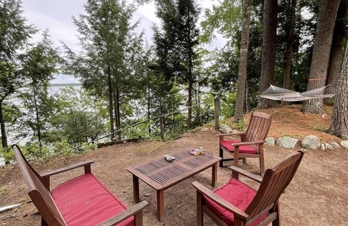 Standish Cottage | Cottage nestled in the woods overlooking Sebago Lake.