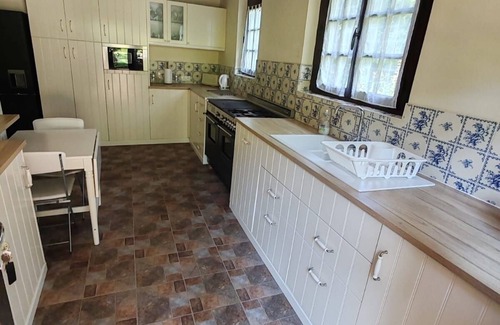 Guerquesalles Cottage | Cottage with shared swimming pool, hot tub, fishing, tennis, UK TV and Wi-Fi