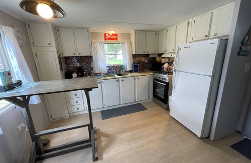 Laketon RV Rental | Cozy 2-bedroom campground in peaceful Claypool with AC, WiFi. Overlooking laken