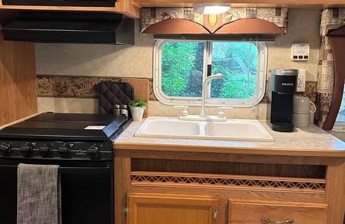 Mohnton House | Cozy 2-bedroom RV- Picnic Area, Fire Ring, and can walk to Maple Grove Raceway