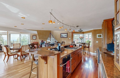 Mid-Hillside Apartment | Cozy apartment with large deck with views, hot tub & wood stove