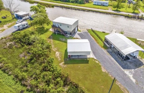 Theriot House | Cozy Bayou Fishing Camp on Brady Road with private Boat Launch and great views!