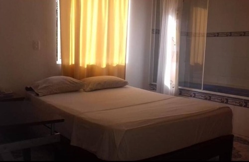 Florida Nueva Hotel | Cozy bedroom in charming Medellín with WiFi