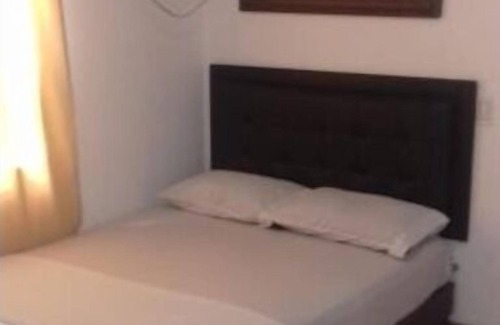 Florida Nueva Hotel | Cozy bedroom in charming Medellín with WiFi