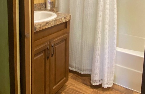Pelican Rapids Cabin | Cozy cabin on a private wooded lot.