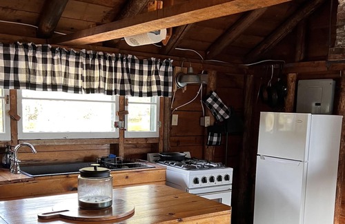 Rangeley Plantation Cabin | Cozy cabin on the water with fantastic views of Mooselookmeguntic Lake.