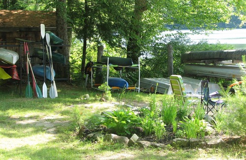 Norway Cabin | Cozy Cedar Log Cabin on Pristine Sand Pond in Norway, great for swimming.