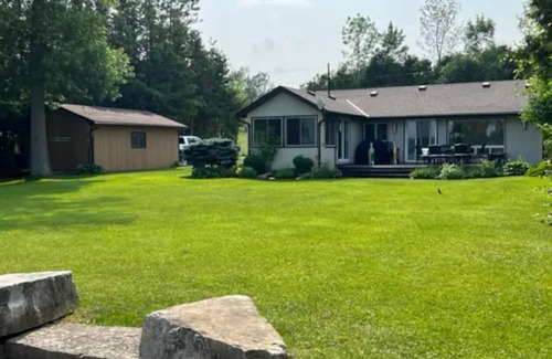Ennismore House | Cozy Cottage remodelled with great private yard beach and dock! 3 Beds 1 Bath