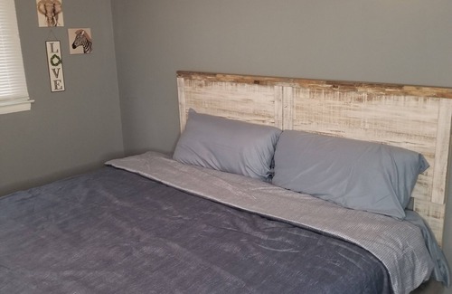 Summit Station House | Cozy Family friendly 4 bedroom house, mins from Downtown with hot tub in bedroom
