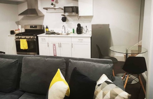 Hamilton House | Cozy, fully equipped open space basement.