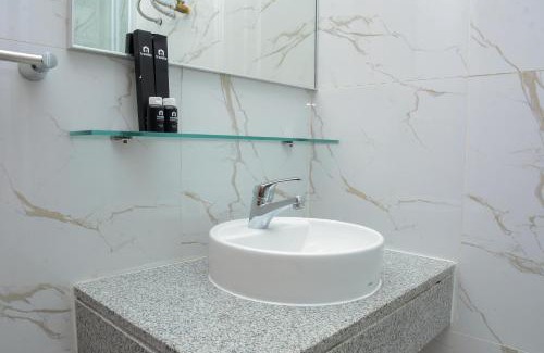 Pekayon Jaya Apartment | Cozy Living 1BR at Grand Kamala Lagoon Apartment By Travelio
