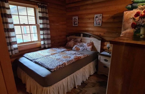 West Bay House | Cozy log cabin with fantastic views and 2 bathrooms