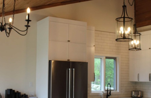 Hillside Beach Cabin | Cozy modern 4 season lake front cottage w/ hot tub