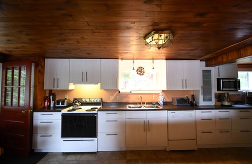 Raymond Cottage | Cozy, pet-friendly 2 bedroom home on Raymond Pond with guest apartment!