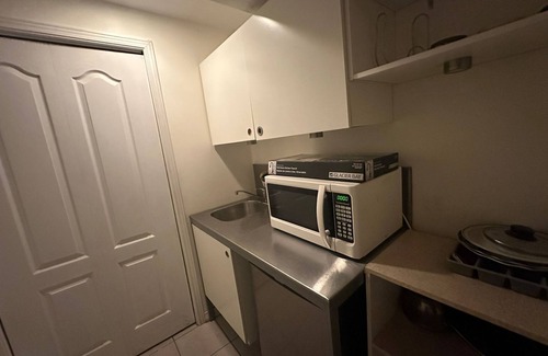 Brampton House | "Cozy, private basement with kitchenette, washroom, and small gym.