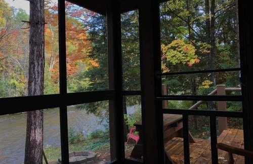 Ellis Township Cabin | Cozy river cabin, steps away from blue ribbon fishing hiking trails.