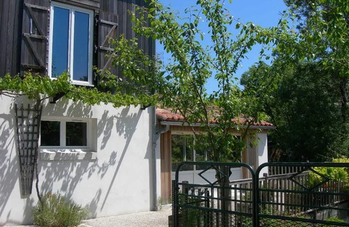 Damvix Cottage | Cozy Riverside Cottage with Canoes, Terrace & Garden in Charming Damvix