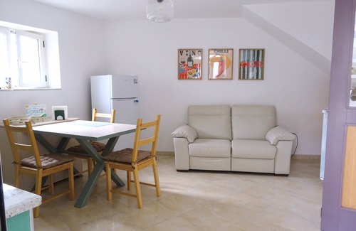 Lustra House | Cozy room on two floors with kitchen and bedroom upstairs.