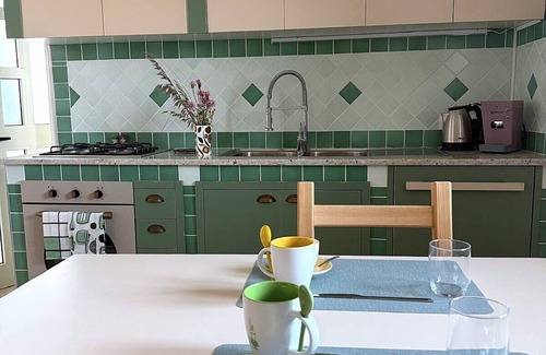 Lustra House | Cozy room on two floors with kitchen and bedroom upstairs.