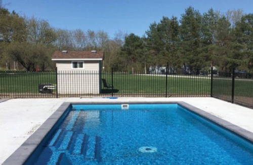 Front of Yonge RV Rental | Cozy solar bunkie cabin located happy green acres campground