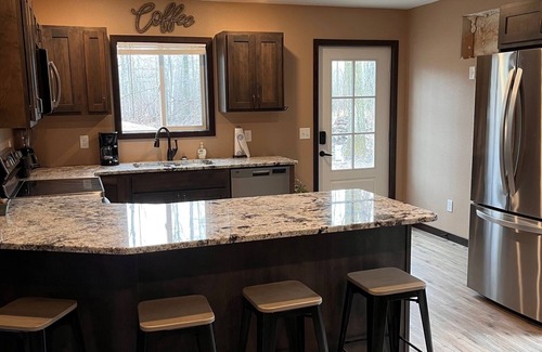 Bemidji House | Cozy two level home - 2 minutes from beach on private wooded lot.